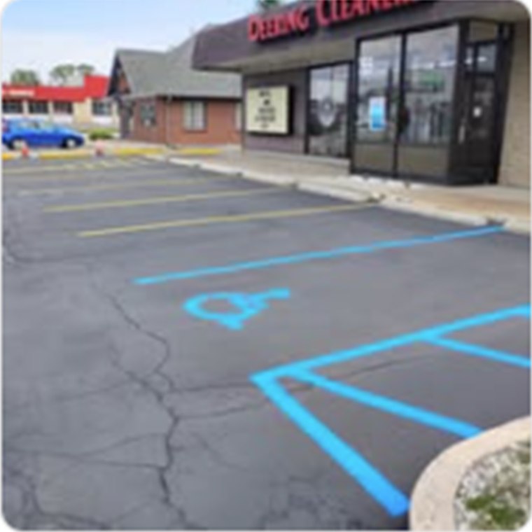 Commercial parking area with refreshed accessible markings